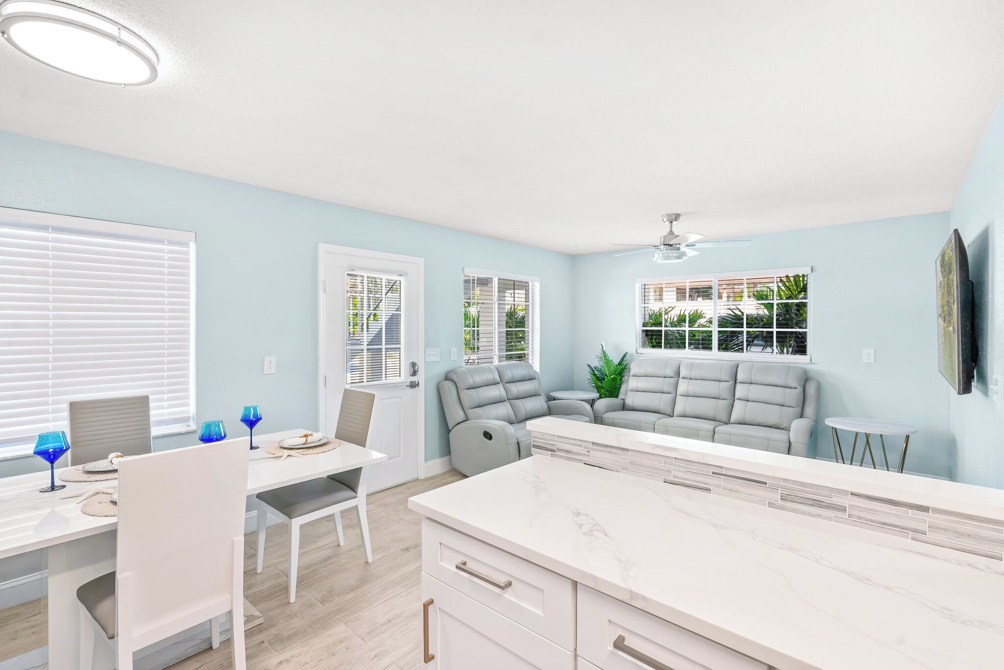 Coastal Boutique Unit 1 kitchen with a large island opening to the living area