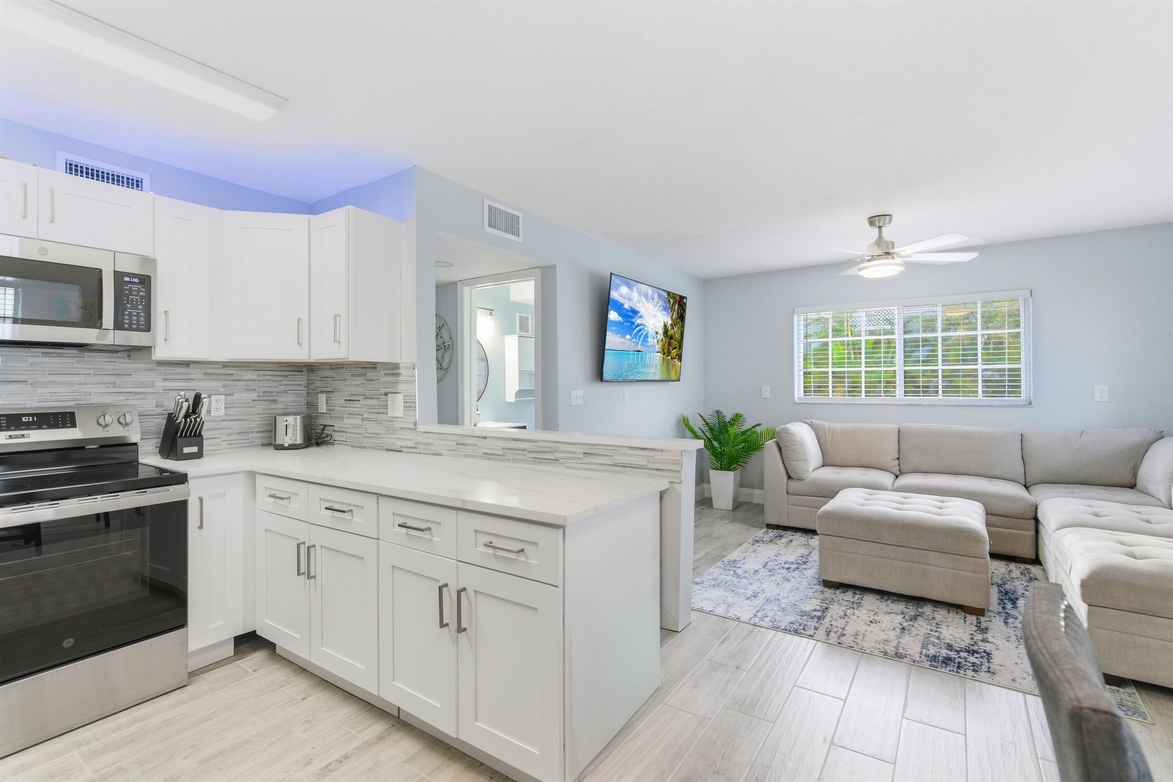 Coastal Boutique Unit 2 kitchen open to the living room