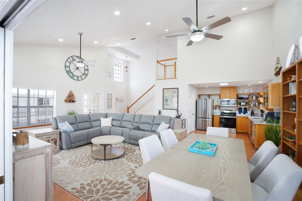 Coastal Getaway open living area with a vaulted ceiling