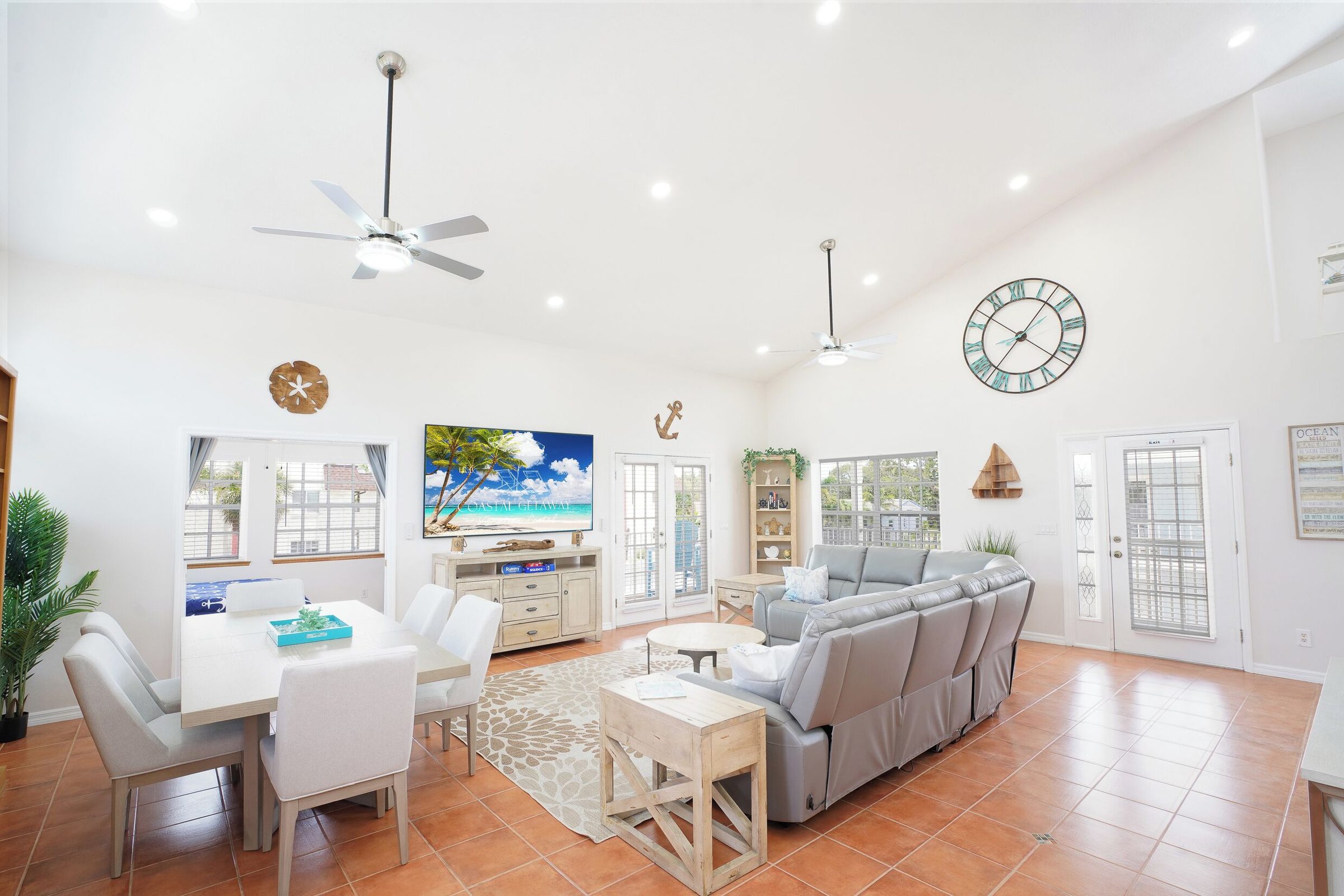 Coastal Getaway living and dining area with ceiling fans