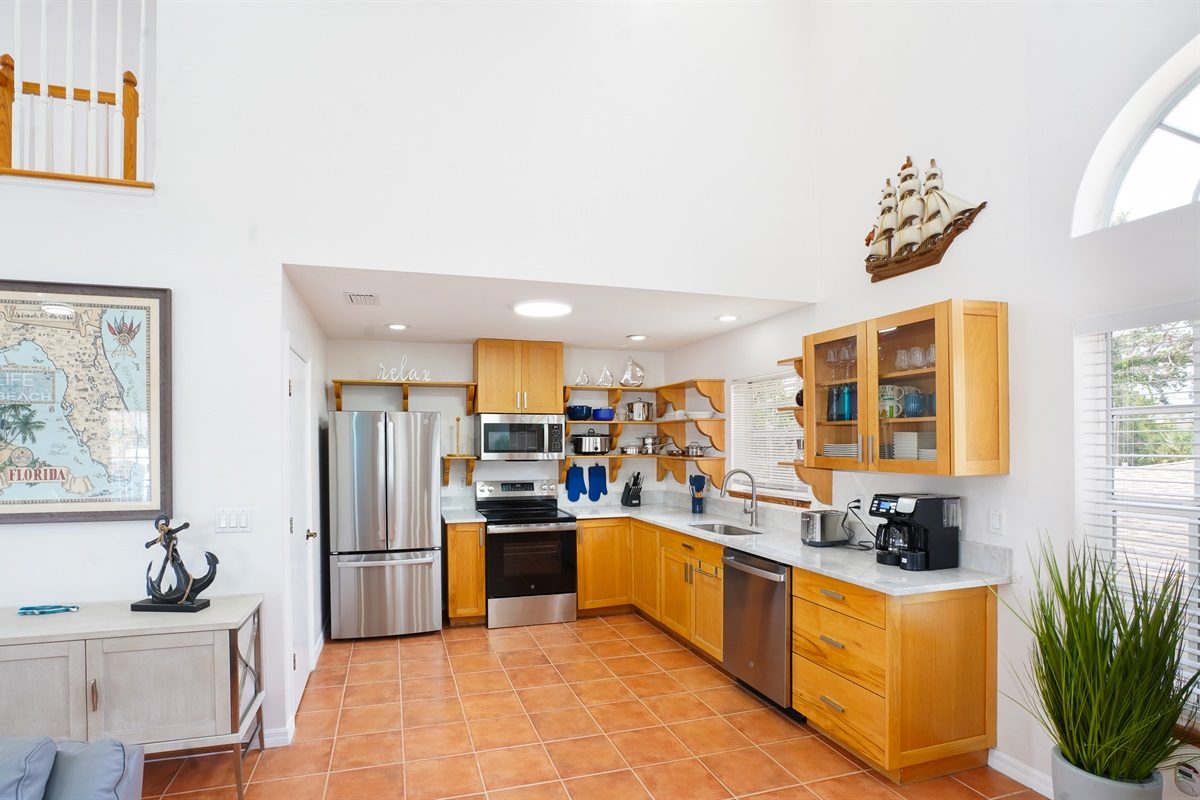 Coastal Getaway kitchen with wood cabinets and stainless steel appliances