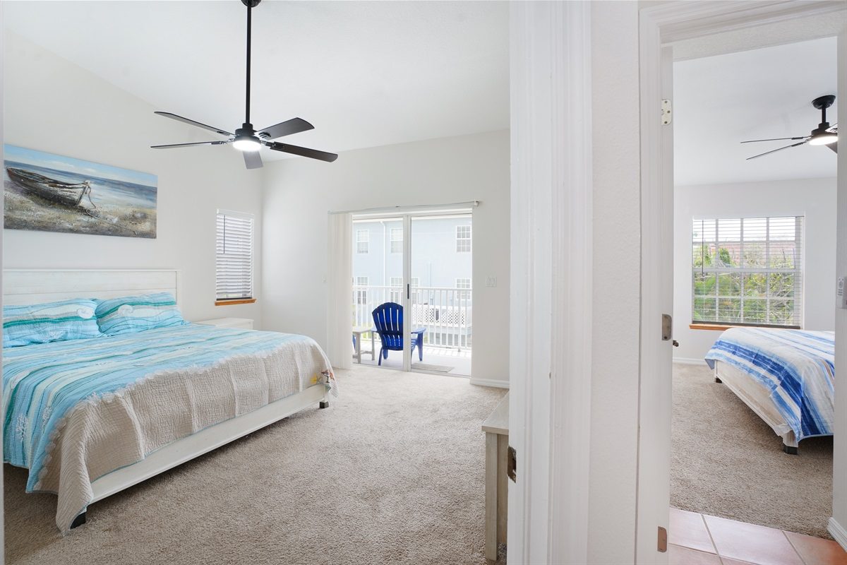King bedroom with doors to the balcony at Coastal Getaway