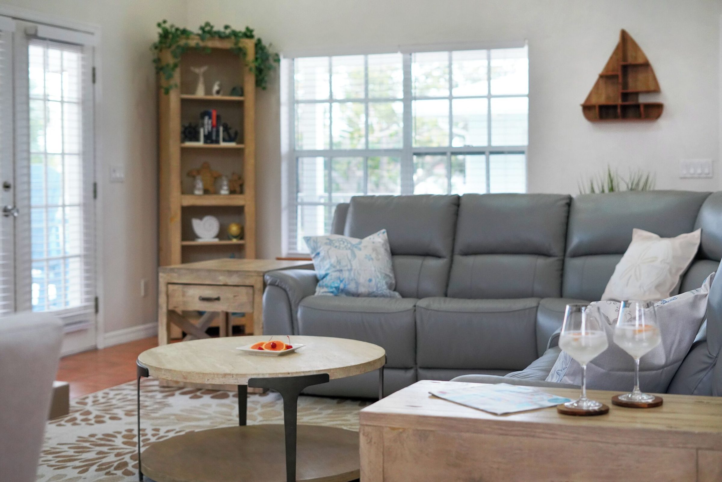 Coastal Getaway living room with a gray sofa and round coffee table