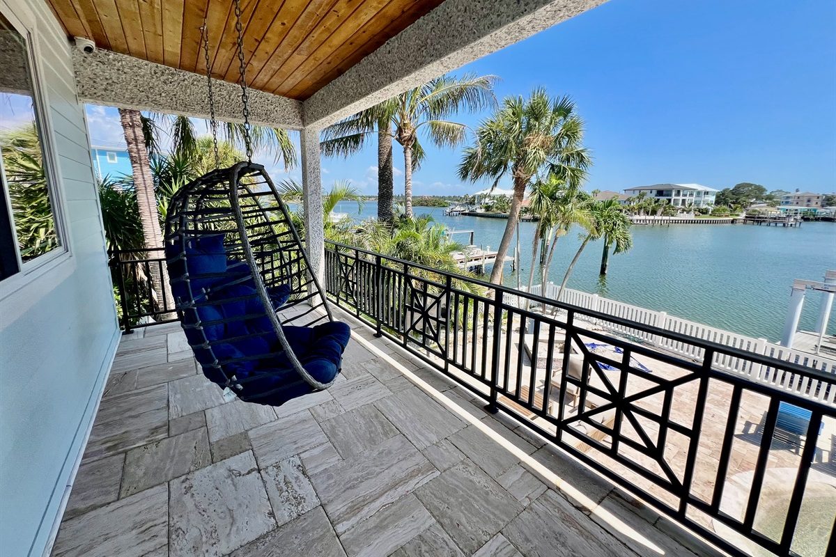 Hanging egg chair on a balcony overlooking the Intracoastal at Coastal Manor