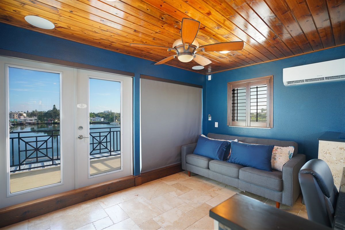 Bonus room with French doors to a water-view balcony at Coastal Manor