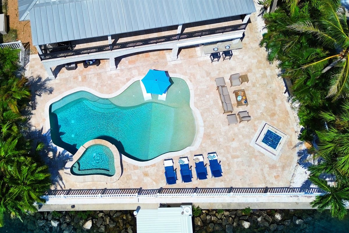 Aerial view of the Coastal Manor pool deck with loungers